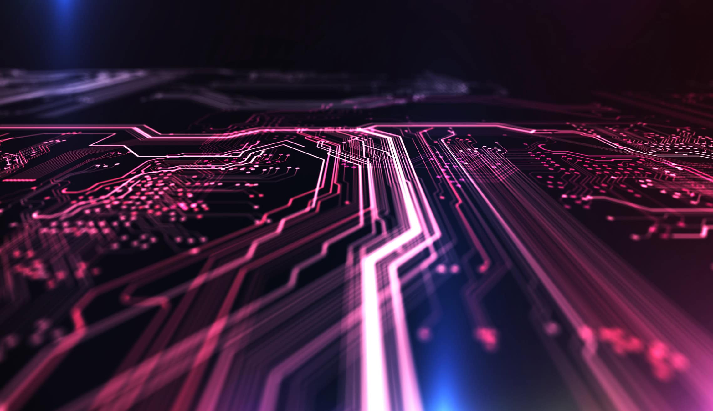 Abstract image of glowing pink and magenta circuit board lines on a dark background, with blue light accents.