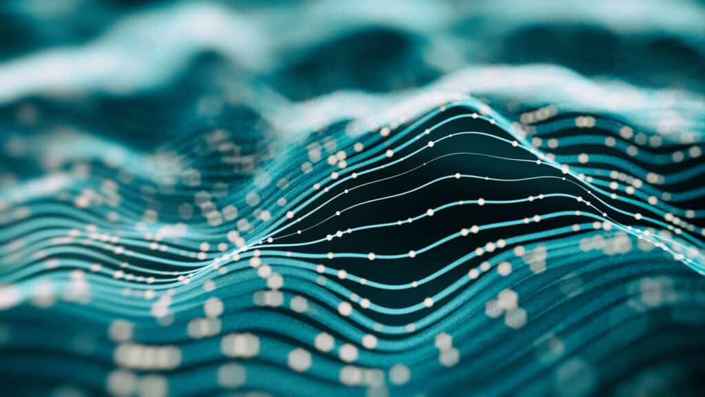 Abstract image of glowing light blue lines with dots forming undulating waves on a dark teal background.