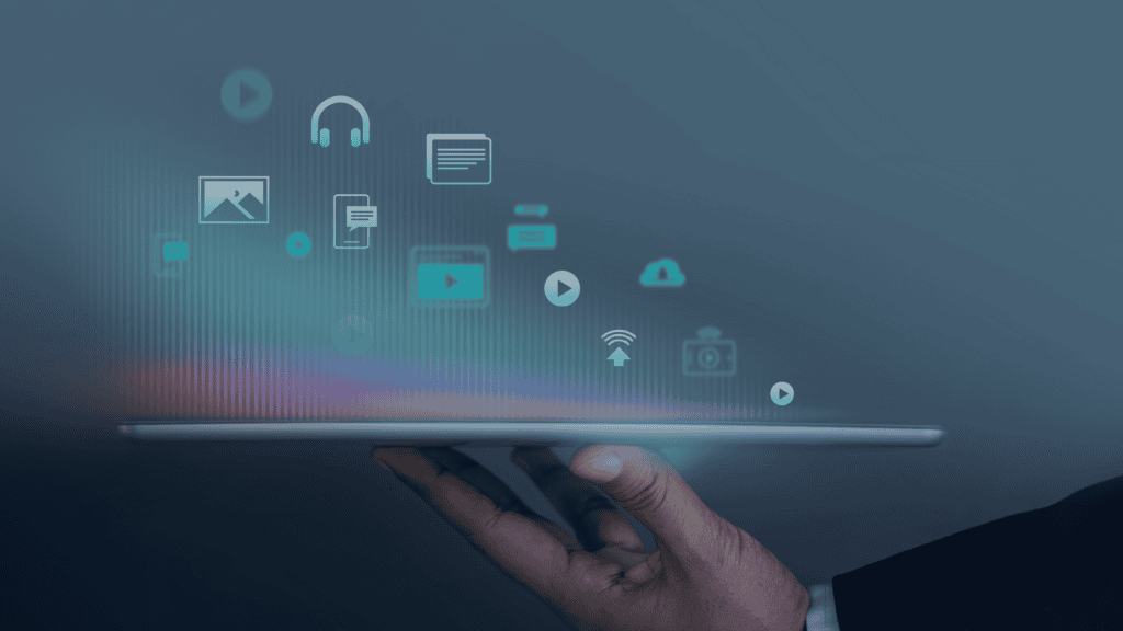 A hand holding a tablet, with various digital content icons like video, audio, image, and cloud floating above it.