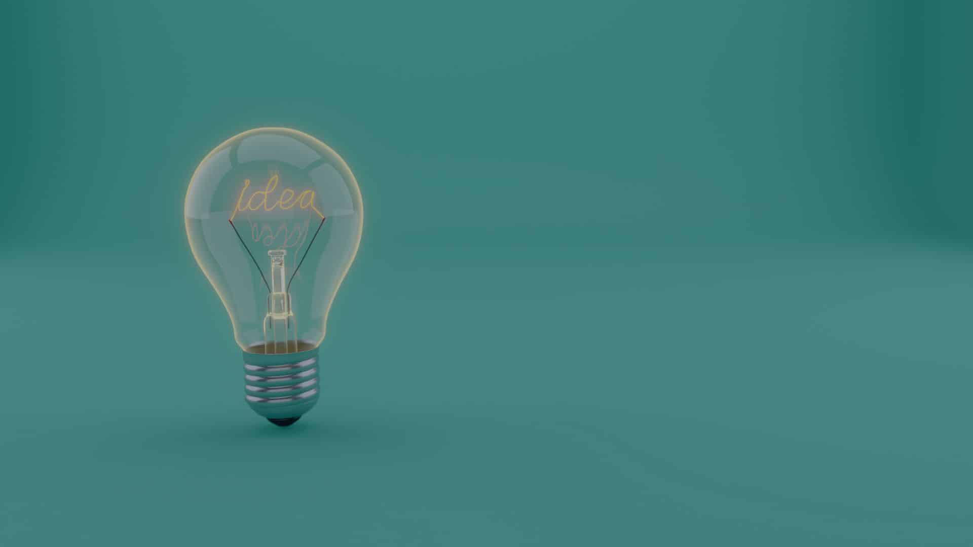 A 3D rendered light bulb with the word "idea" glowing inside, set against a teal background.