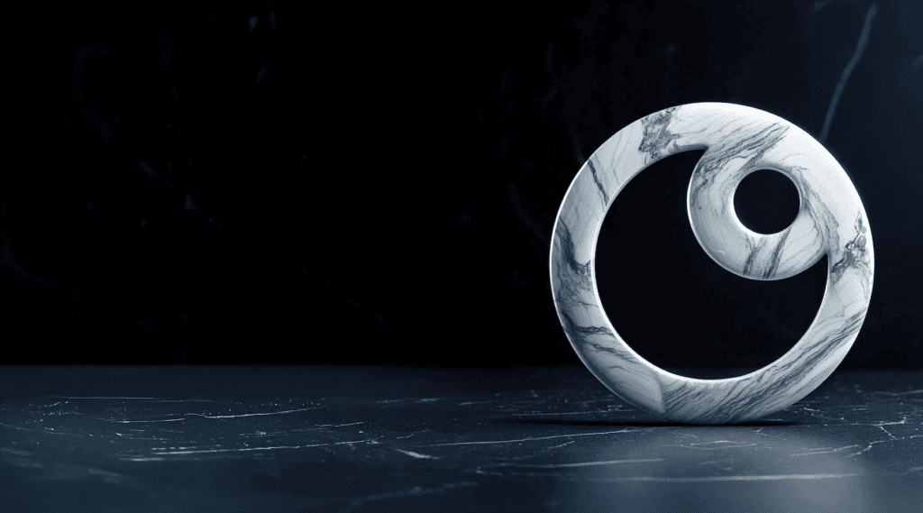 A white marble spiral sculpture with gray veining stands on a dark marble surface against a dark marble background.