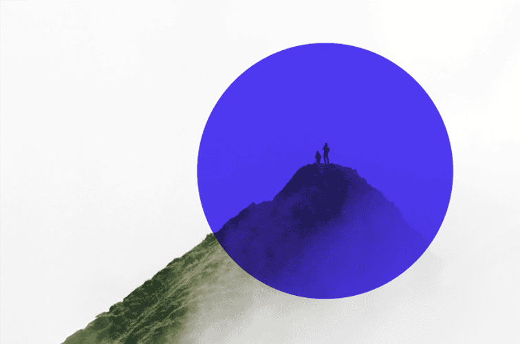 Two people stand on a misty mountain peak, partially covered by a large blue circle.