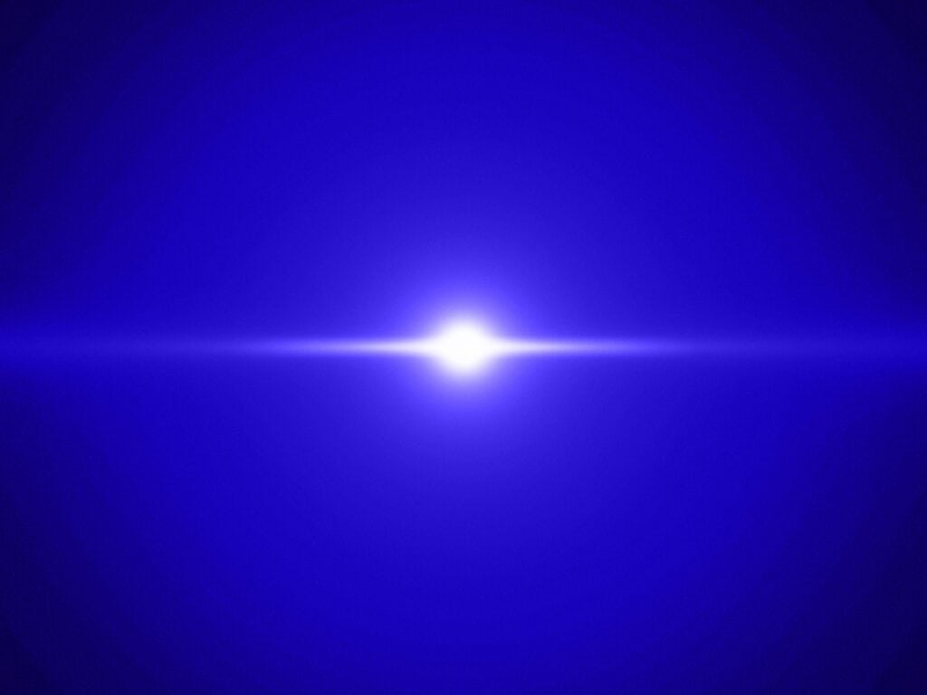 A bright white light source with a horizontal lens flare on a dark blue, textured background.