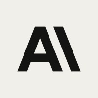 Logo with black stylized letters "AI" on a light beige background.